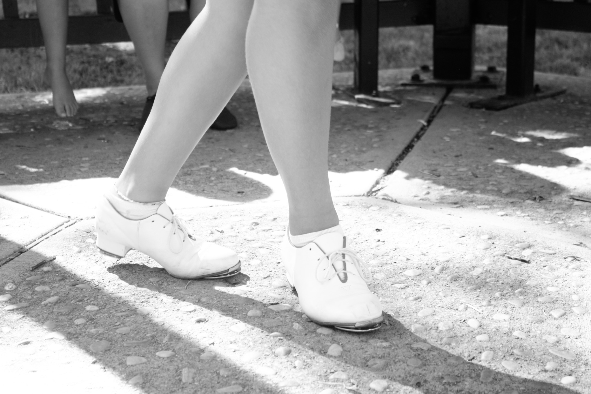 Close-up of a dancer wearing white tap shoes